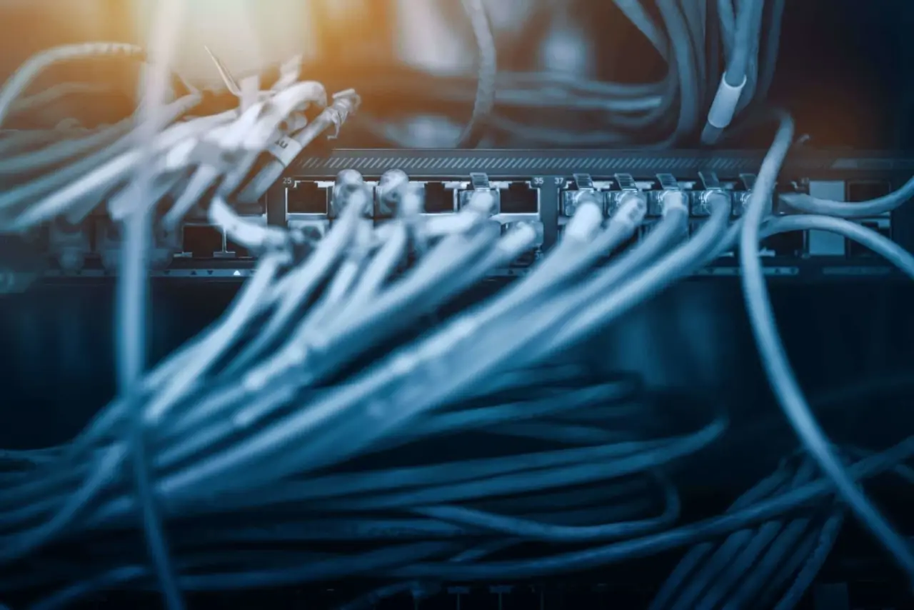 Powerful PoE Extender Distance For Your Surveillance Cameras 2 Extend Ethernet cable connected to switch. Telecommunication concept.